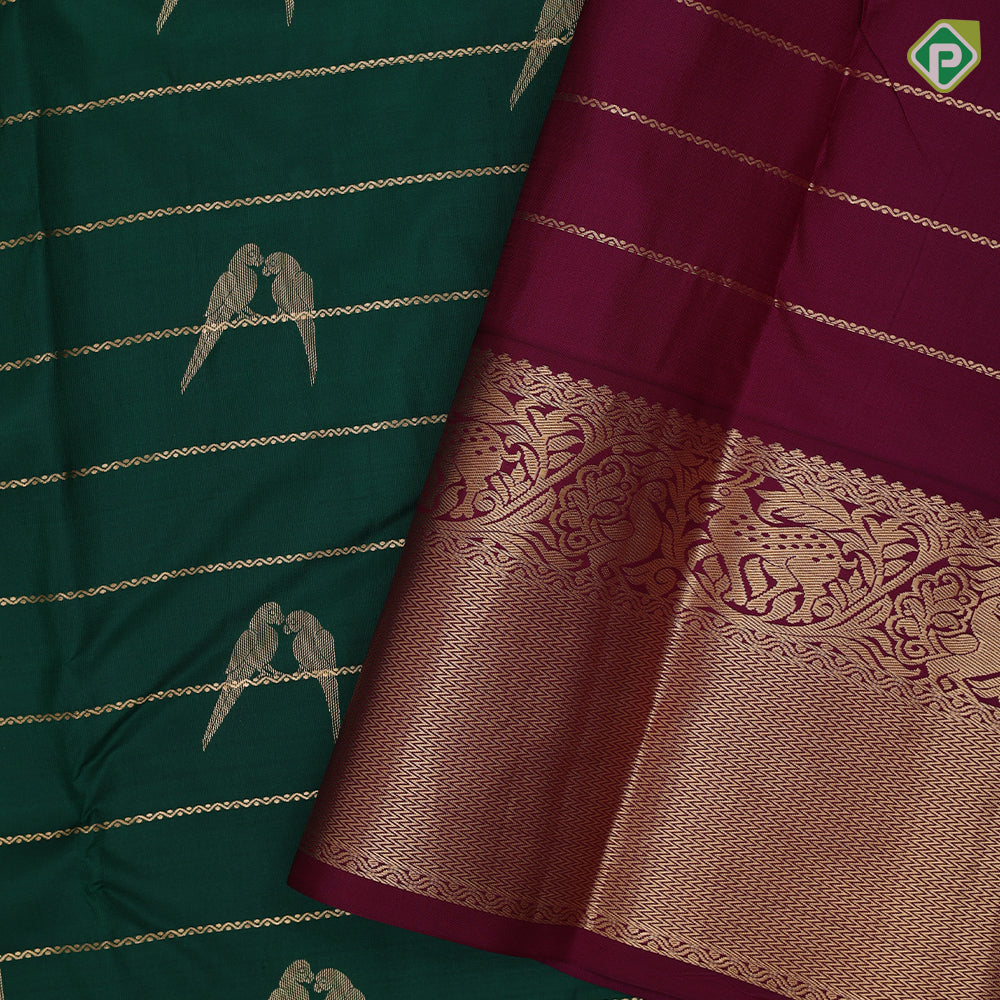 bottle green gold zari velthari lines double parrot butta purple gold zari vanasingaram border traditional silk saree