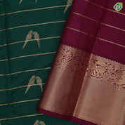 bottle green gold zari velthari lines double parrot butta purple gold zari vanasingaram border traditional silk saree