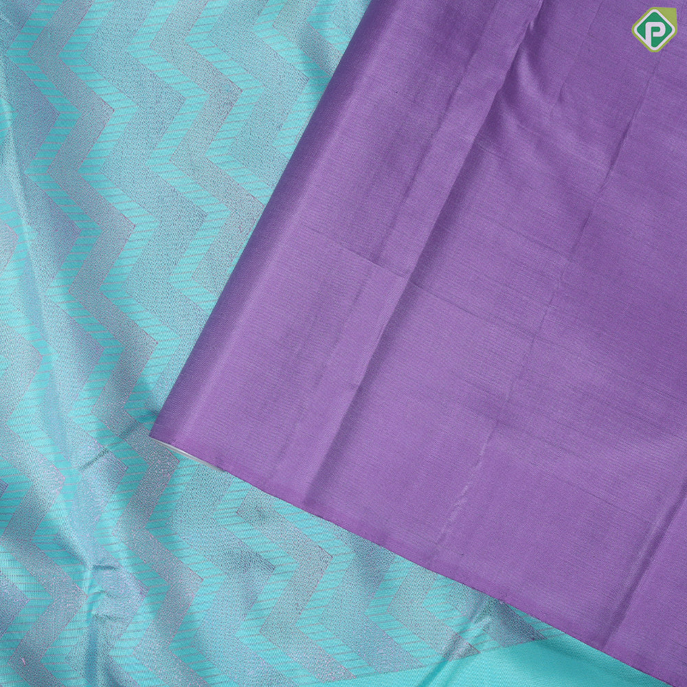 Sea blue lavender zig zag embossed design self meena work big butta border trendy silk saree