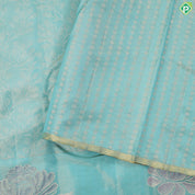 Sea green gold zari grand floral tissue weaved design self meena work floral border trendy tissue silk saree