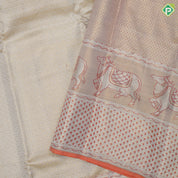 Creamy base gold zari by zari grand brocade design tissue weave self cow and pythonic design pichwai silk saree