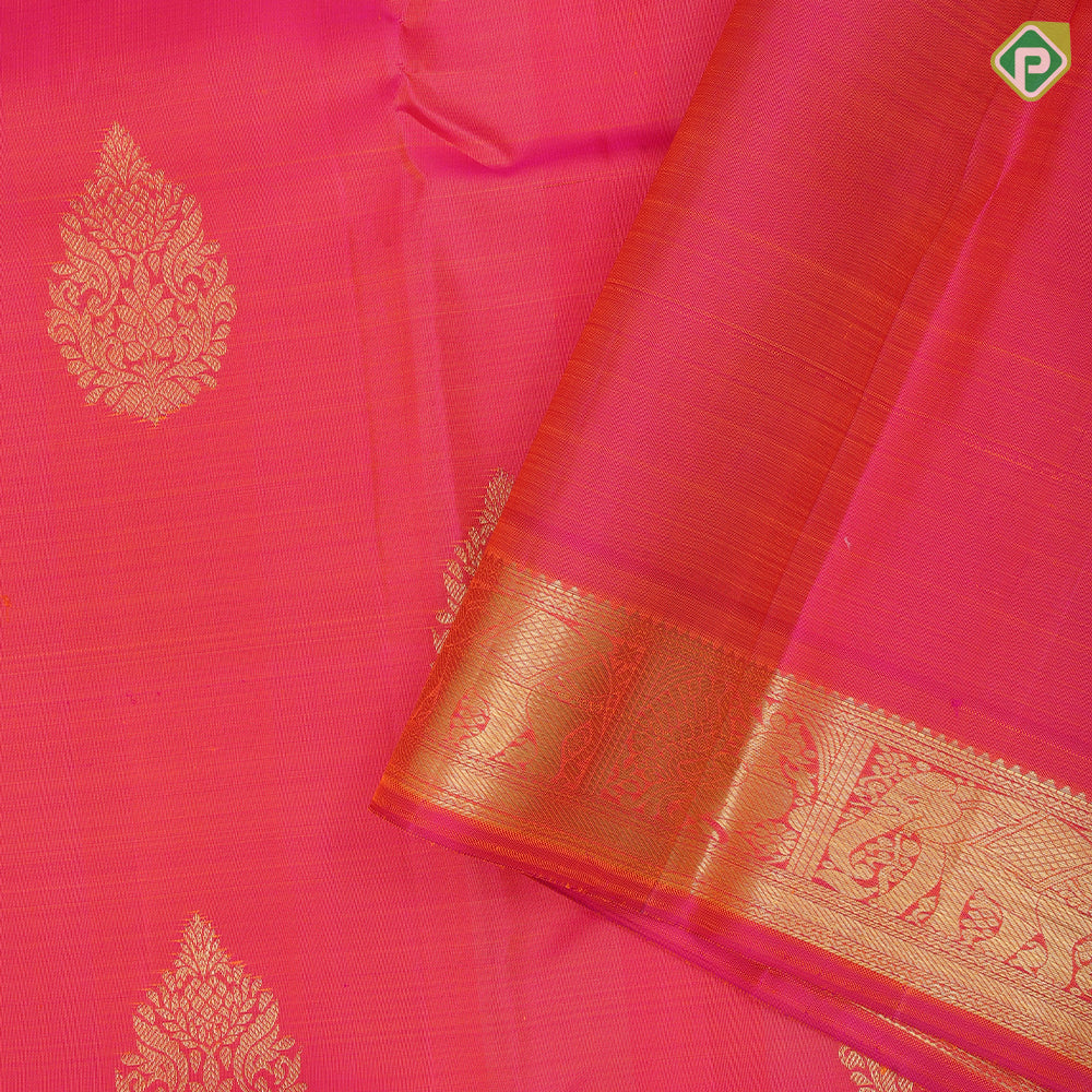Bottle green gold zari fancy thilagam butta design self color gold zari peacock elephant butts edge border traditional silk saree