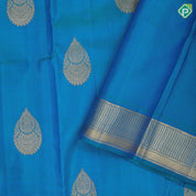 Peacock blue gold zari self designed thilagam butta self color gold zari edge border traditional silk saree