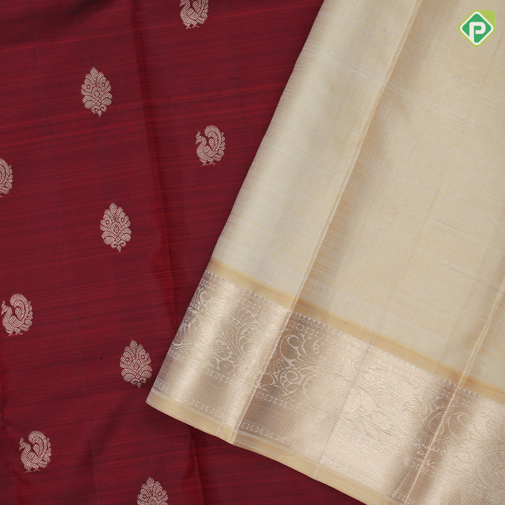 Maroon gold zari peacock fancy leaf butta design sandal gold zari rangoli design border traditional silk saree