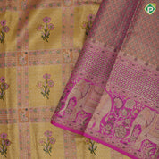 golden yellow with light pink flower bunch in frame design pink gold zari elephant and floral butta border tissue silk saree