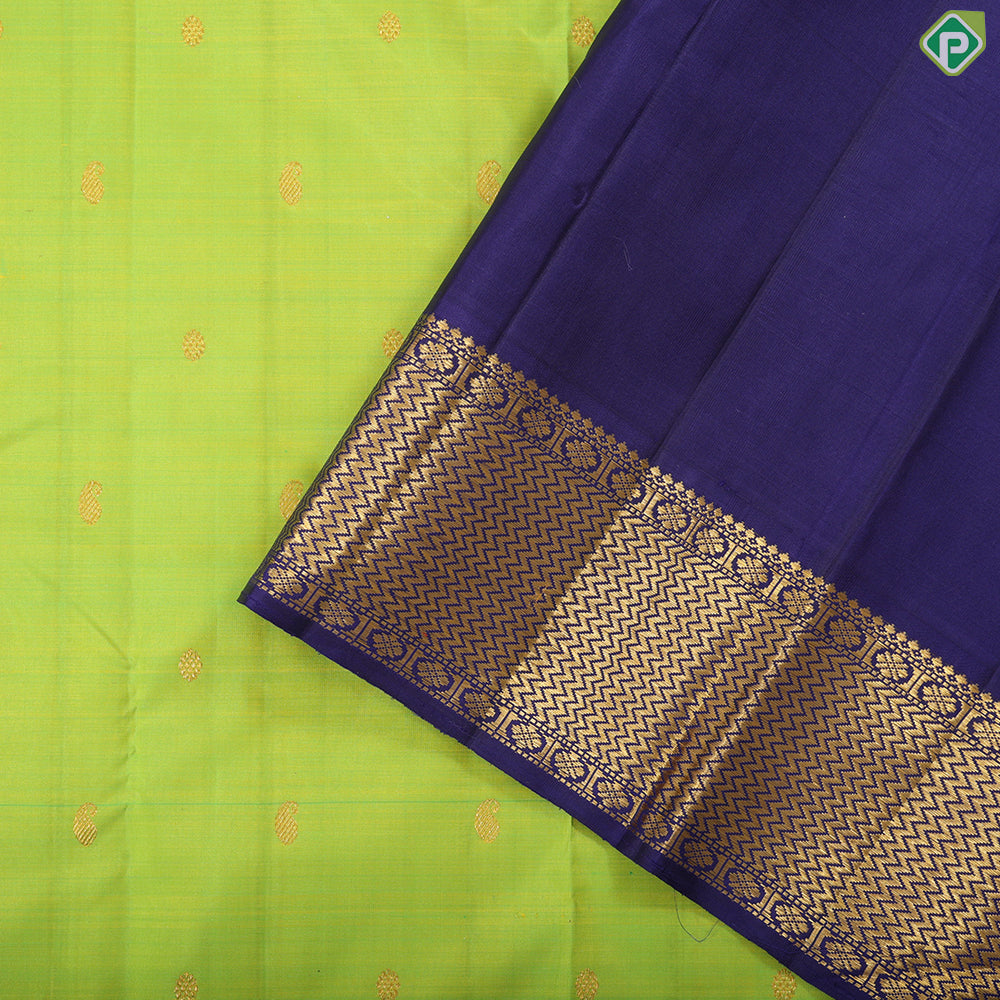 Lemon green gold zari mango butta design indigo blue with gold zari zig zag mid rettapet border traditional silk saree