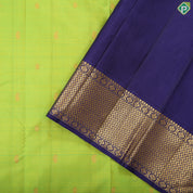 Lemon green gold zari mango butta design indigo blue with gold zari zig zag mid rettapet border traditional silk saree