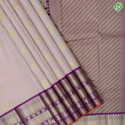 Peach gold zari cow and flower butta design purple gold zari cow flower zig zag design border pure silk saree