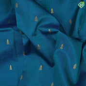 peacock blue gold zari fancy butta contrast green gold zari one side border silk saree