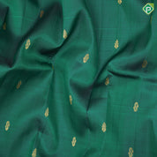 Dark green gold zari fancy butta manthulir green gold zari diamond design one side border silk saree