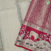 Mint green silver gold zari geometrical brocade design contrast rani pink gold zari wild effect pythonic design border grand tissue silk saree