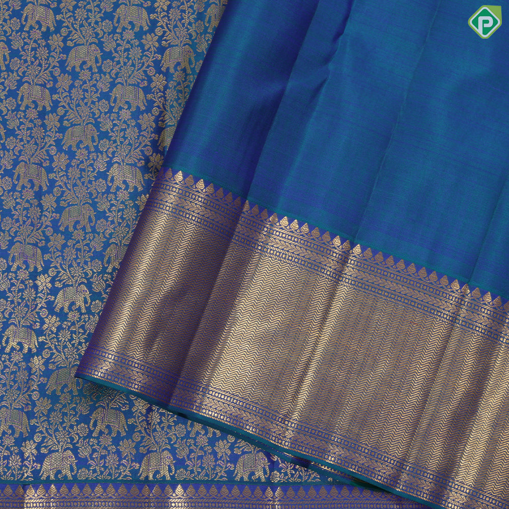 Peacock green gold zari elephant grand floral design self gold zari zig zag border grand bridal silk saree