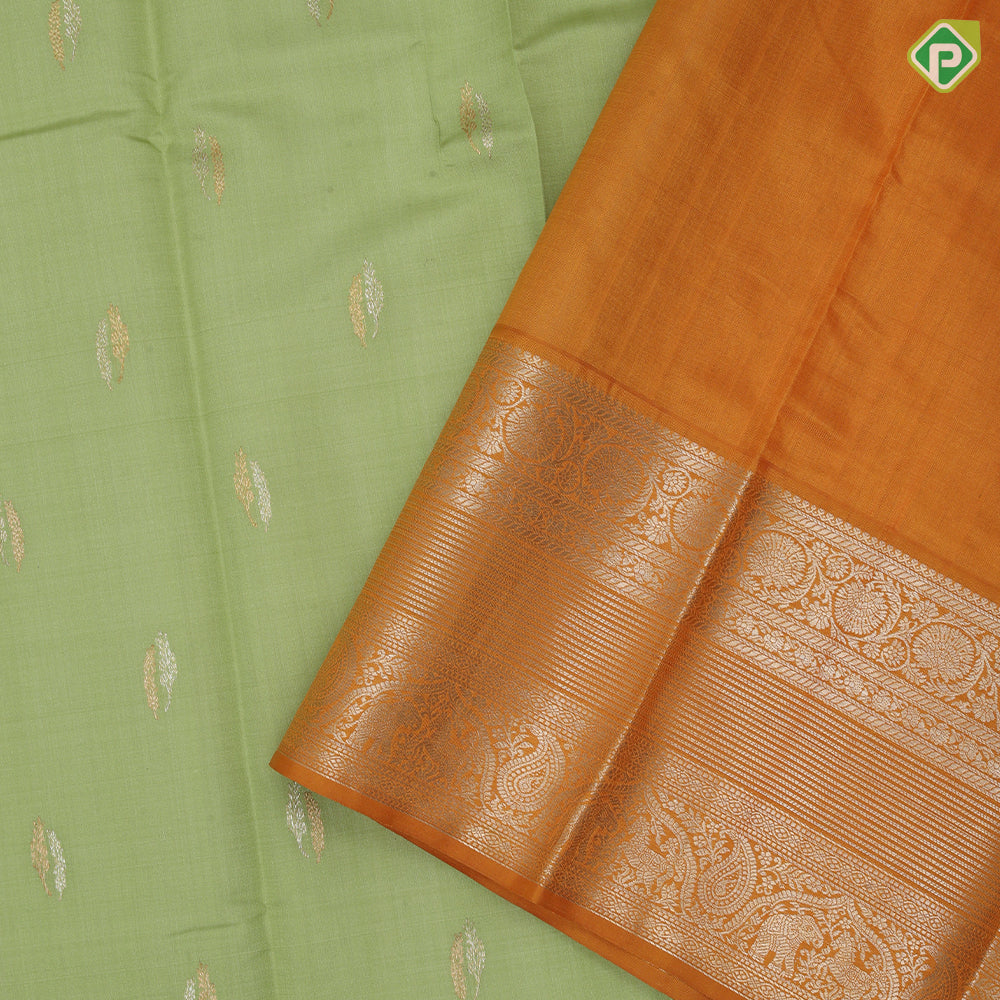 Cardamon green silver gold zari double cone butta mustard yellow silver gold zari rangoli border traditional silk saree