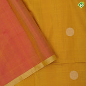 Emarald green silver gold zari round dots self gold zari border contrast orange pallu soft silk saree