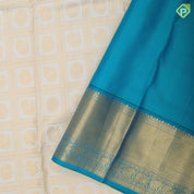 White gold zari annam chakkaram butta checks design peacock green gold zari zig zag stripes border bridal silk saree