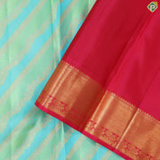Pista green sky blue and gold zari cross lines design contrast pink gold zari border grand bridal silk saree