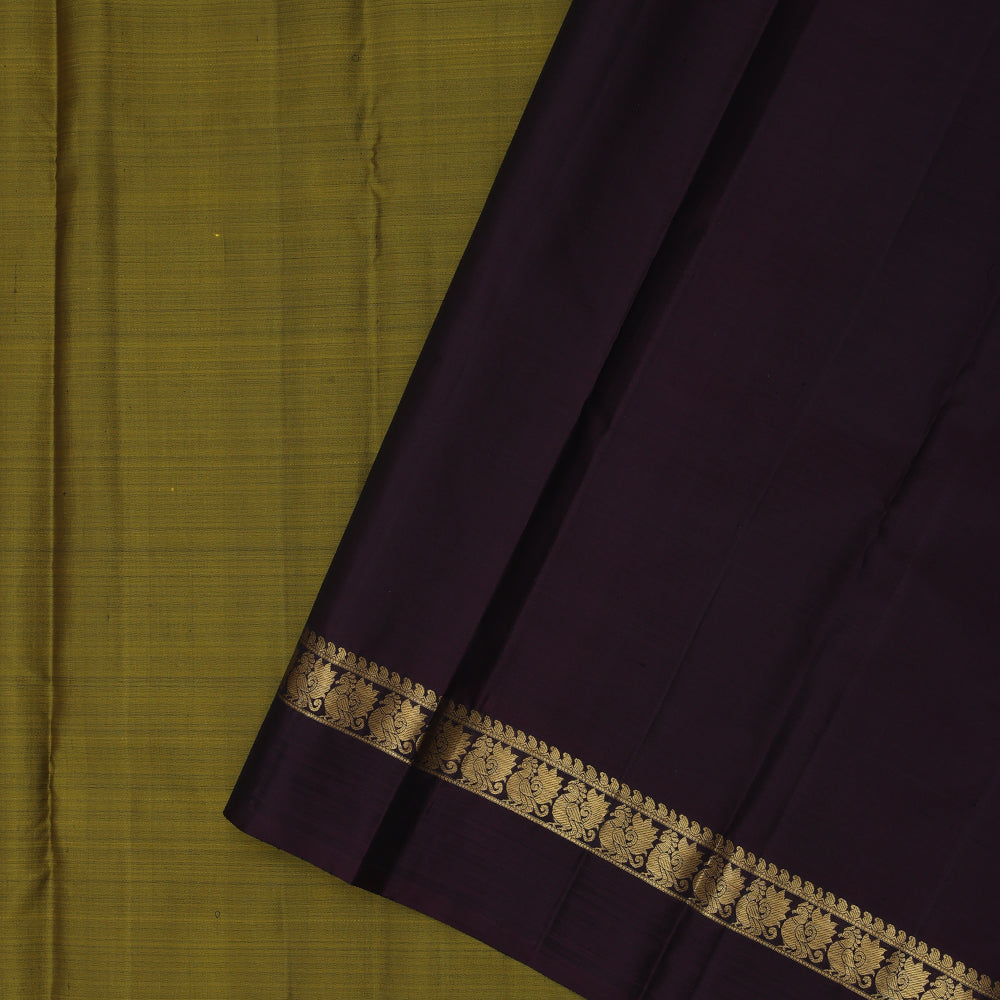 Manthulir green plain weaved contrast brown gold zari peacock butta line border Plain traditional vintage silk saree