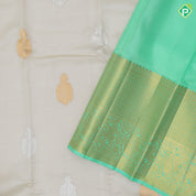 creamy sandal silver gold zari double peacock butta rexona green gold zari High border traditional silk saree