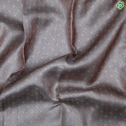 Dark peach silver zari zari by zari butta and shimmer design self cow and tree border master weaved pichwai silk saree