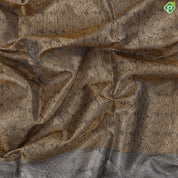 Golden yellow grand waves zari by zari weaved design Greyish self art effect scenery border trendy tissue silk saree