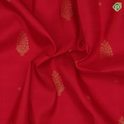 Tomato red gold zari thilagam and double gaja yaali butta self gold zari rettapattai border traditional silk saree