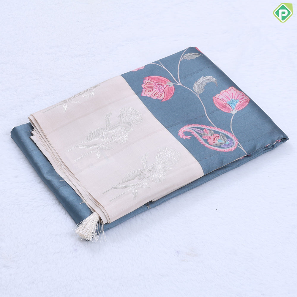 Violet with multi color floral creeper design contrast cream with silver zari flower border semi tusser saree