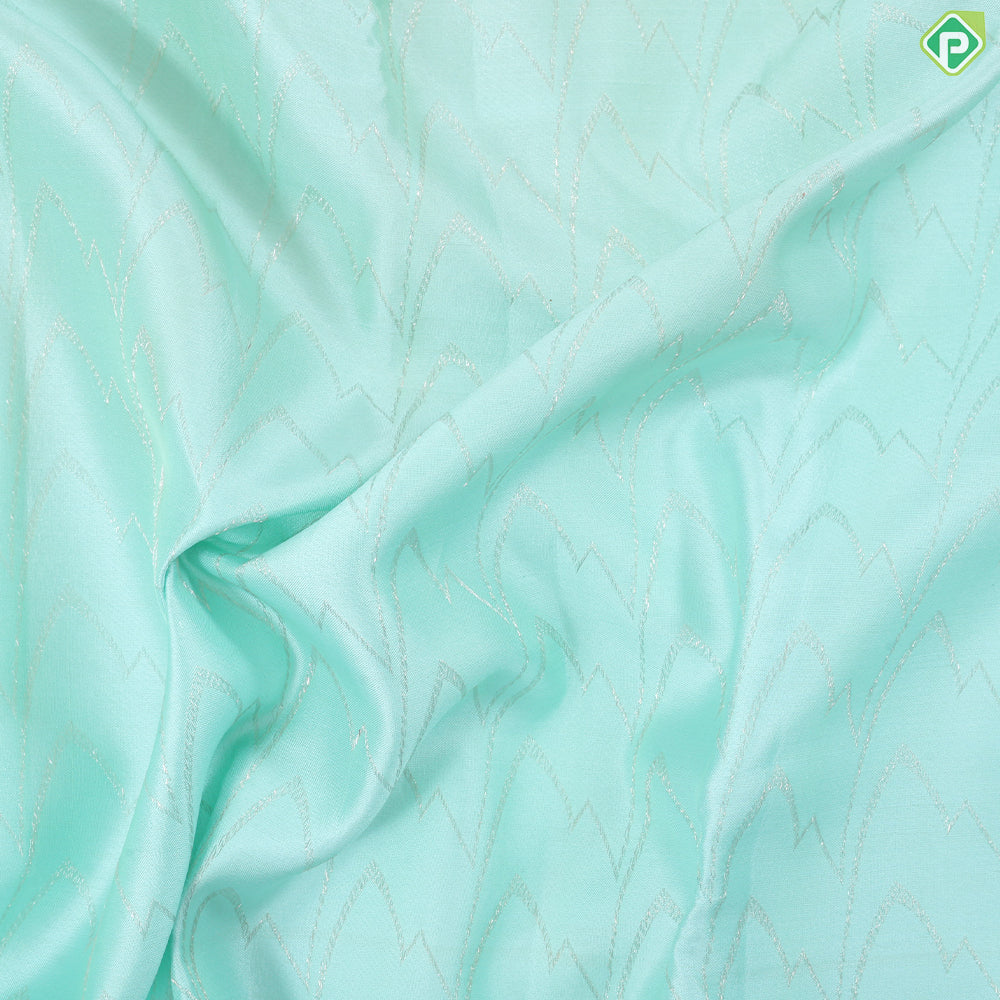 Suffire green silver zari zig zag waves design self multi color pythonic border grand bridal silk saree