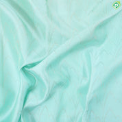 Suffire green silver zari zig zag waves design self multi color pythonic border grand bridal silk saree