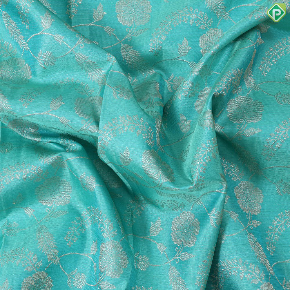 Cool green silver gold zari grand floral design contrast pink border grand bridal silk saree