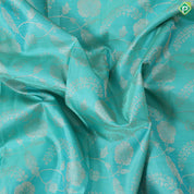 Cool green silver gold zari grand floral design contrast pink border grand bridal silk saree