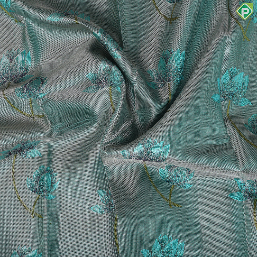 greyish green lotus flower embossed design peacock green gold zari border trendy silk saree