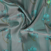 greyish green lotus flower embossed design peacock green gold zari border trendy silk saree