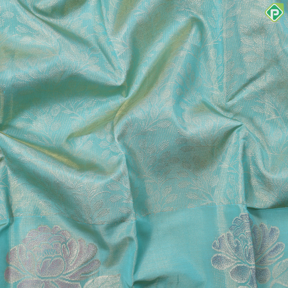 Sea green gold zari grand floral tissue weaved design self meena work floral border trendy tissue silk saree