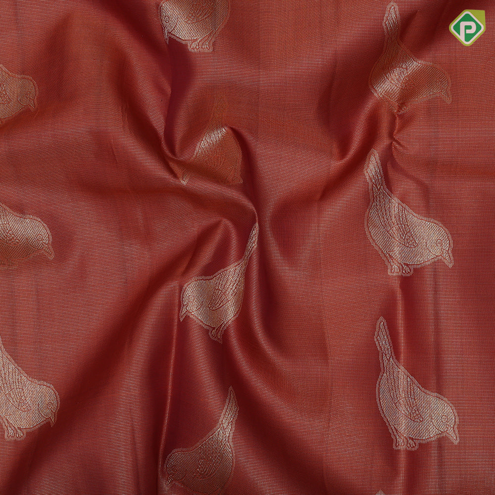 Rust orange tissue weave sparrow butta design contrast maroon gold zari rangoli mid border traditional silk saree