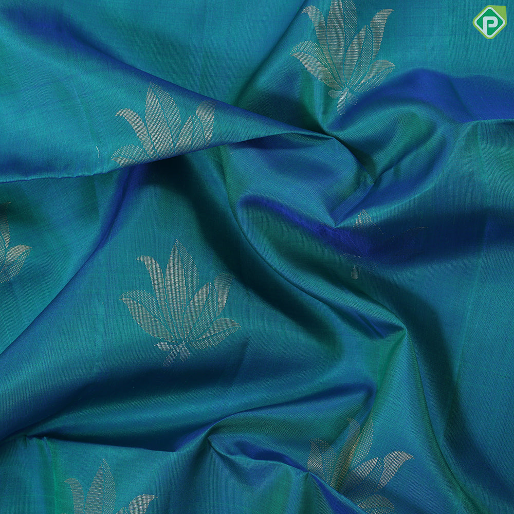 Peacock blue fancy lotus butta design self gold zari border grand pallu soft silk saree