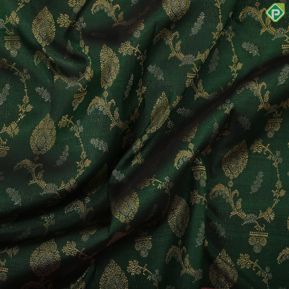 Forest green gold zari grand floral design contrast pale pink gold zari border grand bridal silk saree