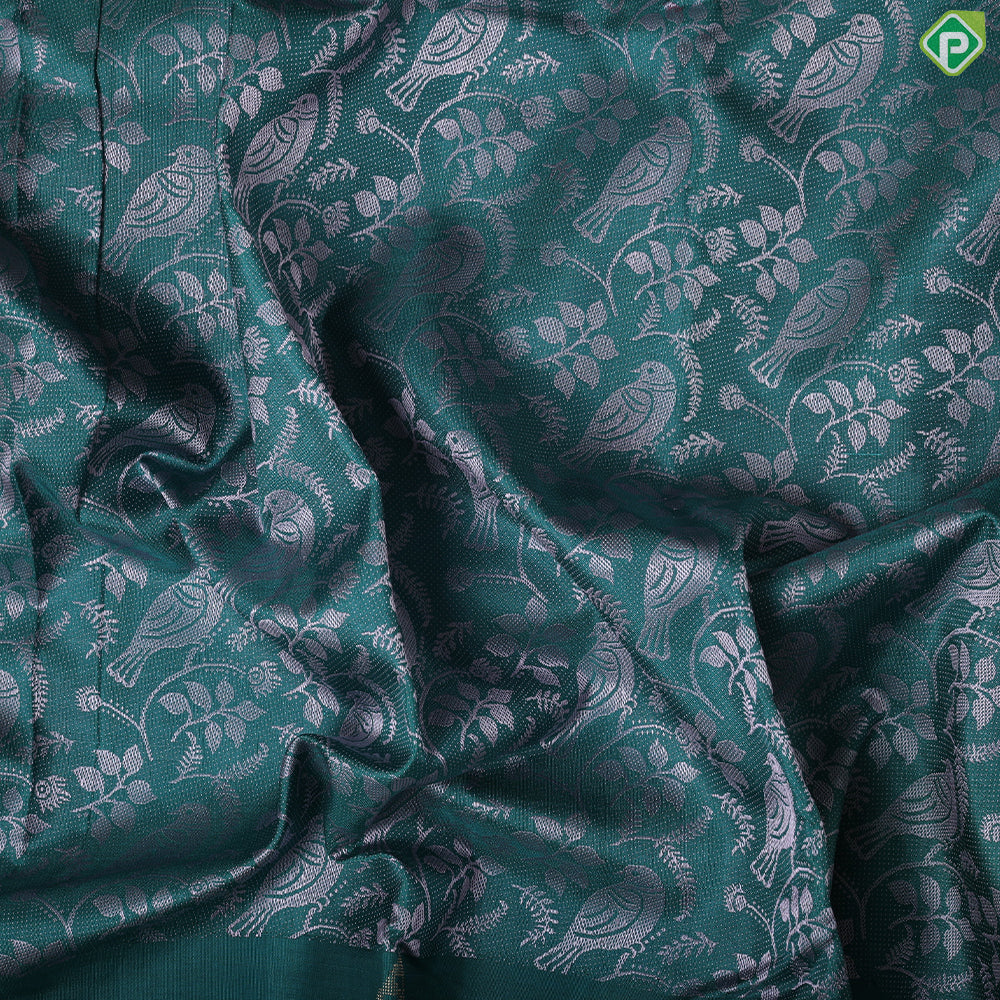 Pine green cream sparrow embossed design self gold zari drop butta border trendy silk saree