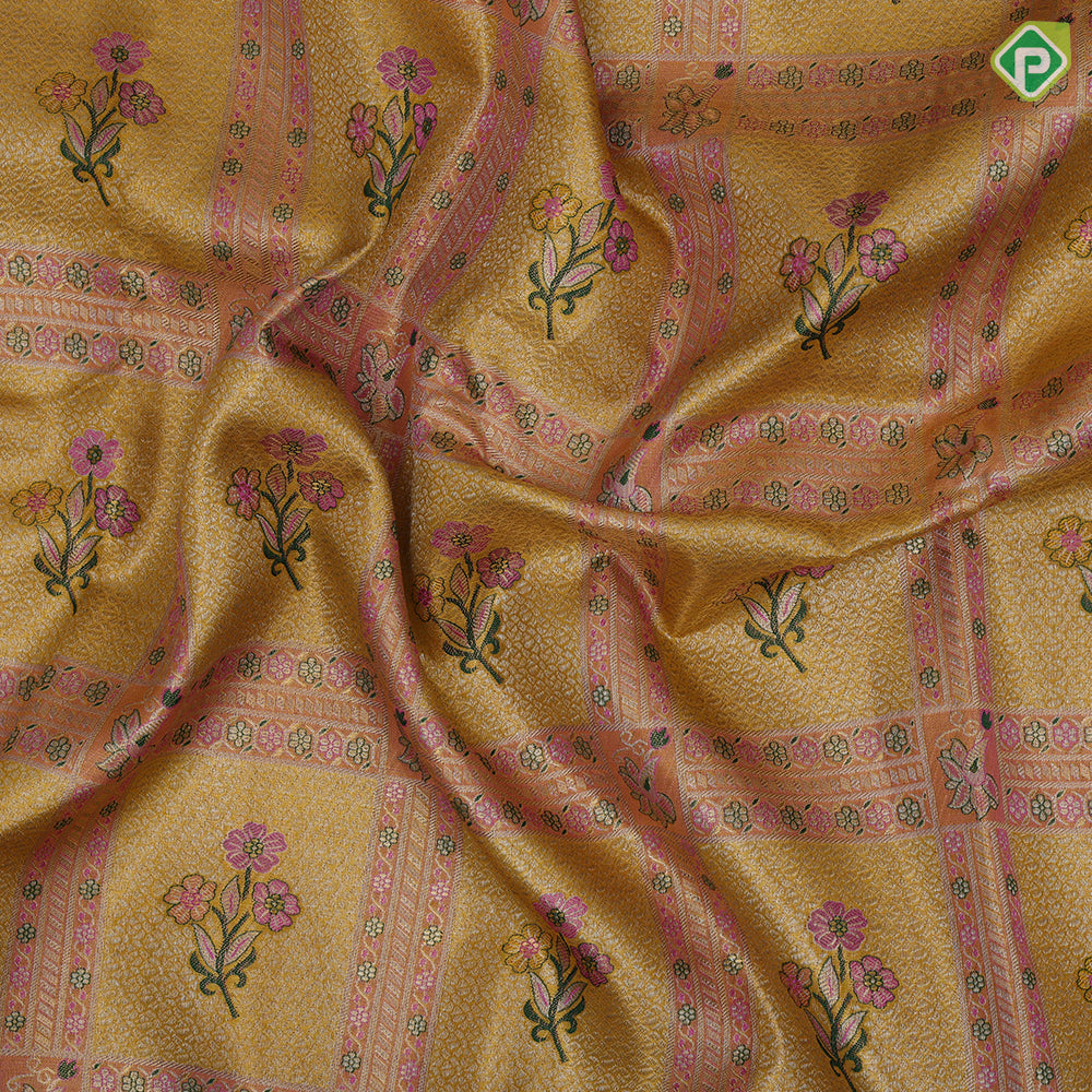 golden yellow with light pink flower bunch in frame design pink gold zari elephant and floral butta border tissue silk saree
