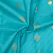 Sea green gold zari thilagam butta contrast pink gold zari peacock border traditional silk saree
