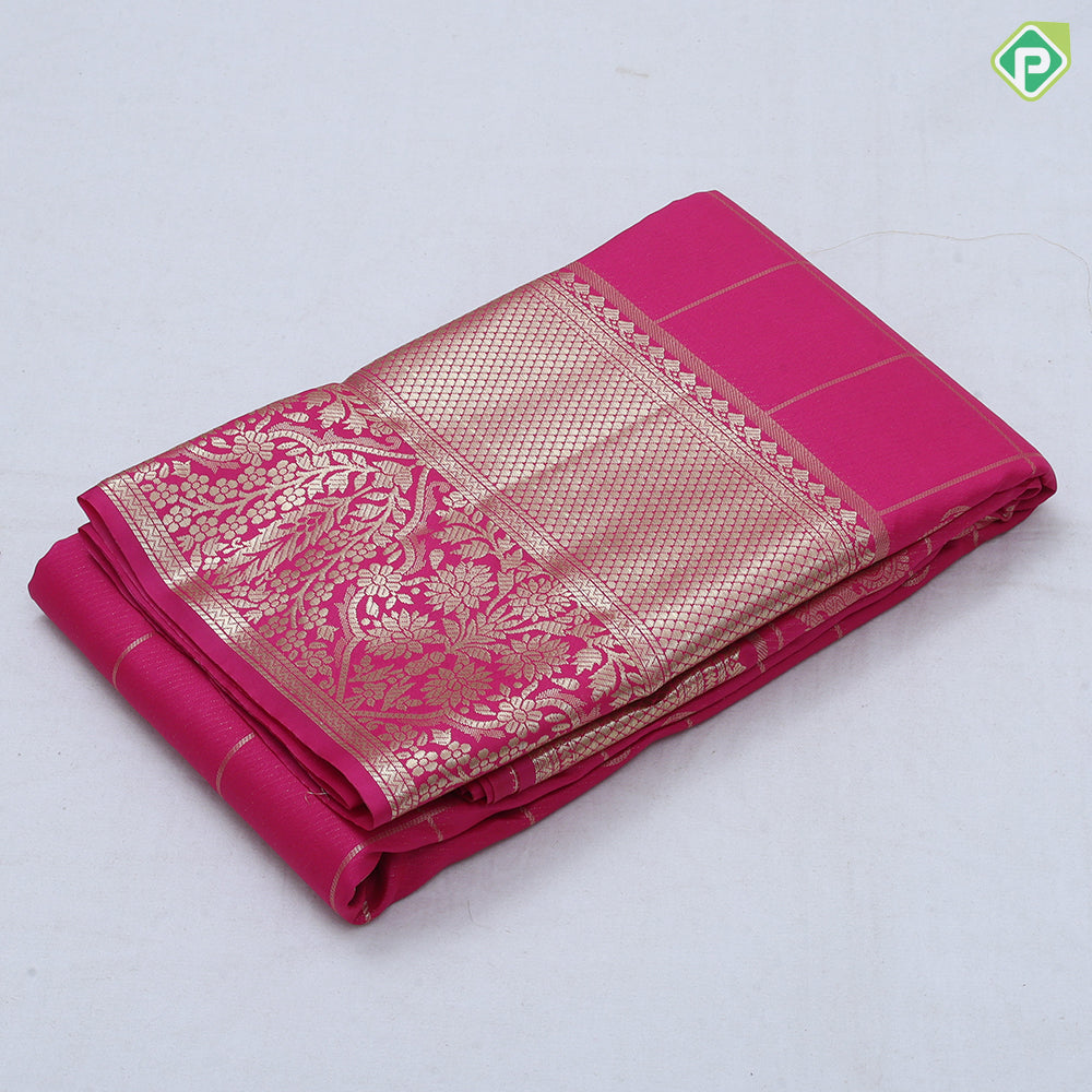 Rani pink gold zari double peacock deer round butta self gold zari flower and diamond border art silk saree