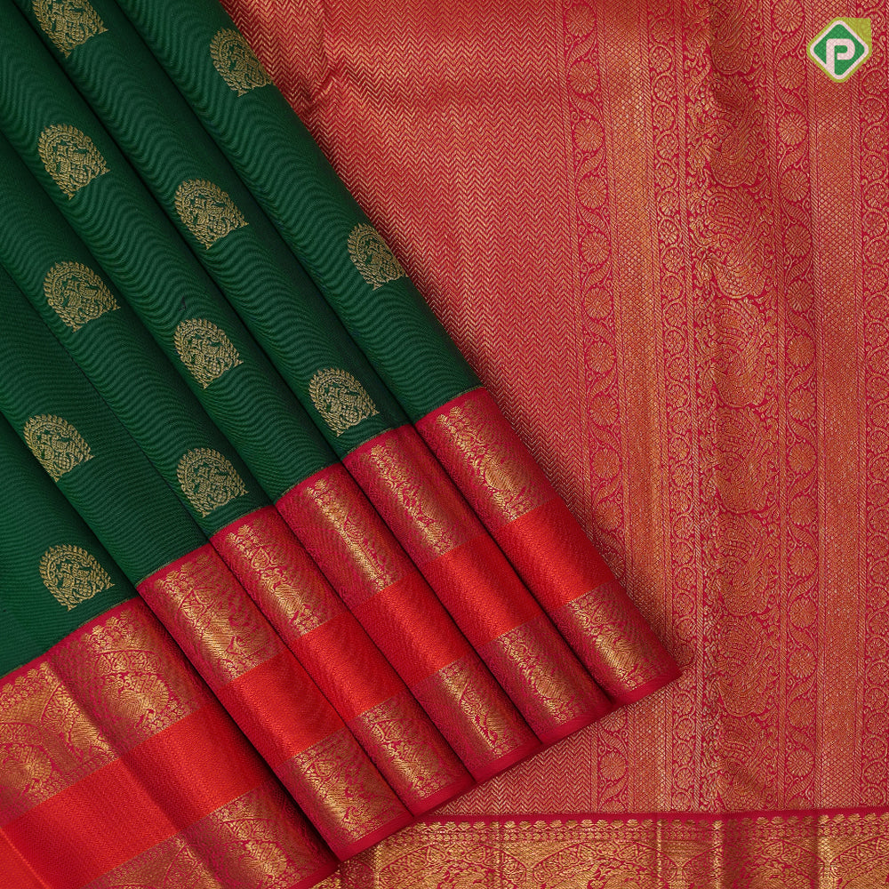 Bottle green gold zari arch and double peacock butta red gold zari elephant and arch retta pett border silk saree