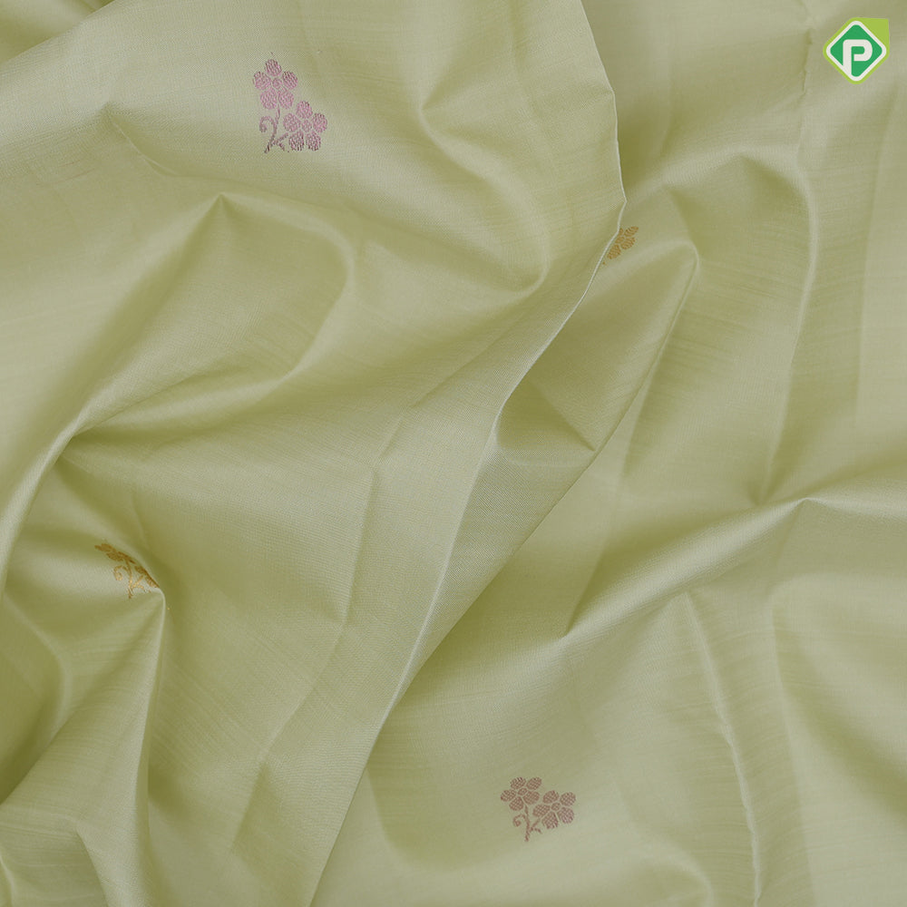 Pista green rose gold neem zari fancy flower butta motifs self tuning floral border trendy designer silk saree