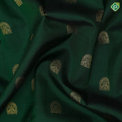 Bottle green gold zari arch and double peacock butta red gold zari elephant and arch retta pett border silk saree