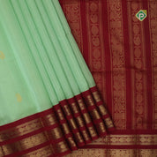 Pista green butta design red grand pallu concept rani red gold zari border silk cotton saree