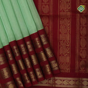 Pista green butta design red grand pallu concept rani red gold zari border silk cotton saree
