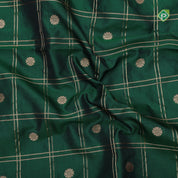 bottle green gold zari double check flower butta self gold zari pythonic border banaras style silk saree