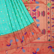 peacock green gold zari double check flower butta red gold zari pythonic border banaras style silk saree