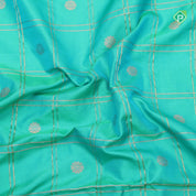 peacock green gold zari double check flower butta red gold zari pythonic border banaras style silk saree