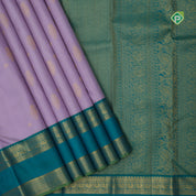 Lavender silk thread gold zari stripes mid flower butta design contrast green gold zari rettapet border Traditional silk saree