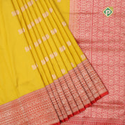 mango yellow gold zari peacock butta design contrast red gold zari rangoli design lines border banaras silk saree